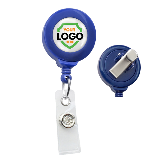 A blue Standard Custom Printed Badge Reel w/ No Twist Design - Add Your Logo to Personalize with a custom logo placeholder and a clear plastic strap attachment. Another badge reel is shown from the back, displaying a silver clip. Ideal for promoting brand awareness, these custom badge reels enhance your professional image.