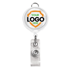 White badge reel with a metal clip and a circular area for a customizable logo within an orange shield shape, accompanied by a clear plastic strap. Ideal for brand awareness, the Custom Badge Reel with Belt Clip and Lanyard Attachment - Add Your Logo can feature your personalized graphic to make your brand stand out.