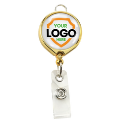 A Custom Badge Reel with Belt Clip and Lanyard Attachment - Add Your Logo, perfect for enhancing brand awareness, with a gold-colored clip and a customizable area showcasing a shield outline with the text "YOUR LOGO HERE" in the center.