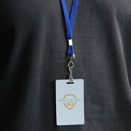 A person wearing a dark shirt has a blue Premium Economy Lanyard with Swivel Hook (3/8″ Flat Width, Non-Breakaway, 2135-350X), securely attached to a Specialist ID badge holder.