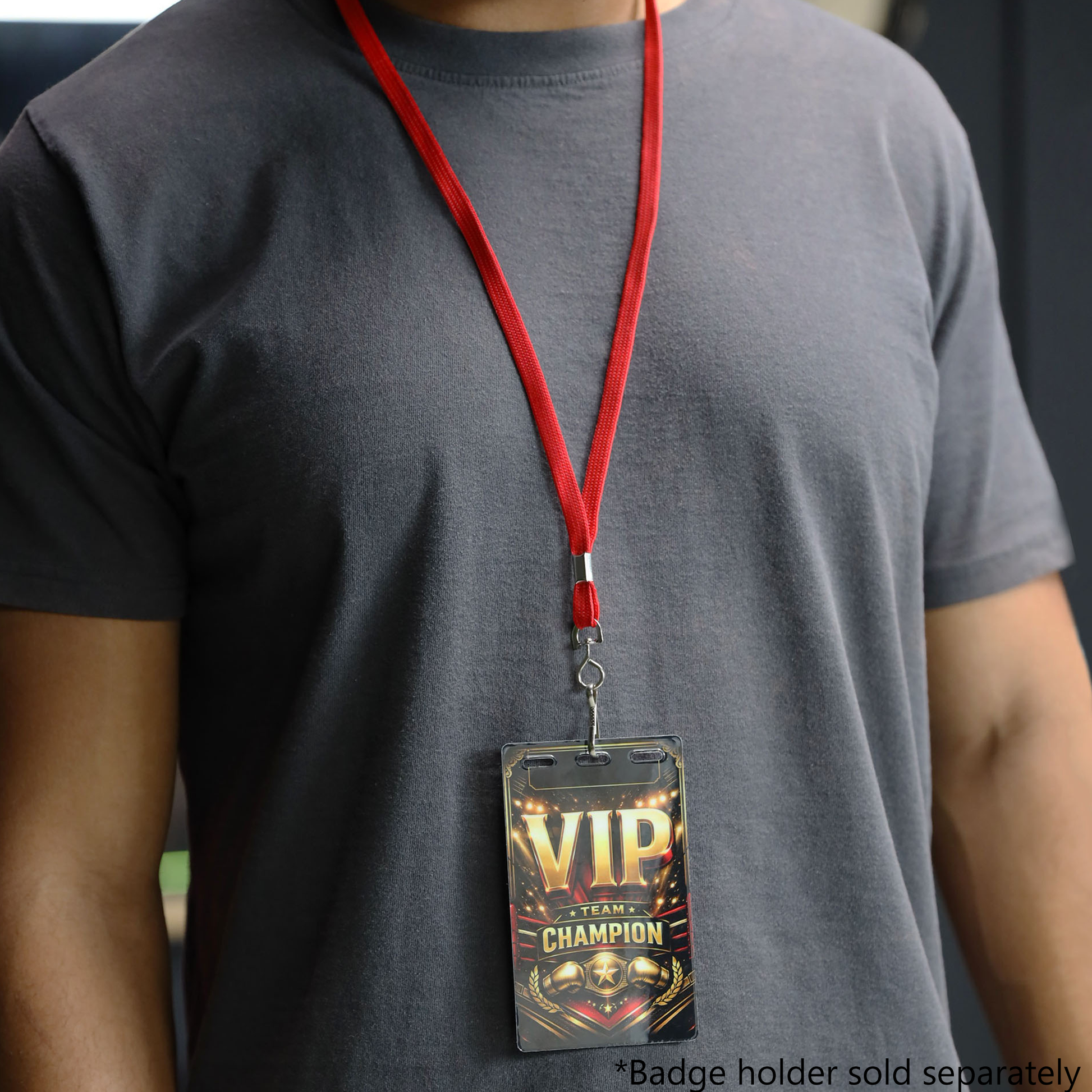Person wearing a plain dark gray t-shirt and a red Premium Economy Lanyard with Swivel Hook (3/8″ flat width, non-breakaway, 2135-350X) holding a “VIP Champion” badge. Badge holder is attached; text at bottom reads, “*Badge holder sold separately.”.