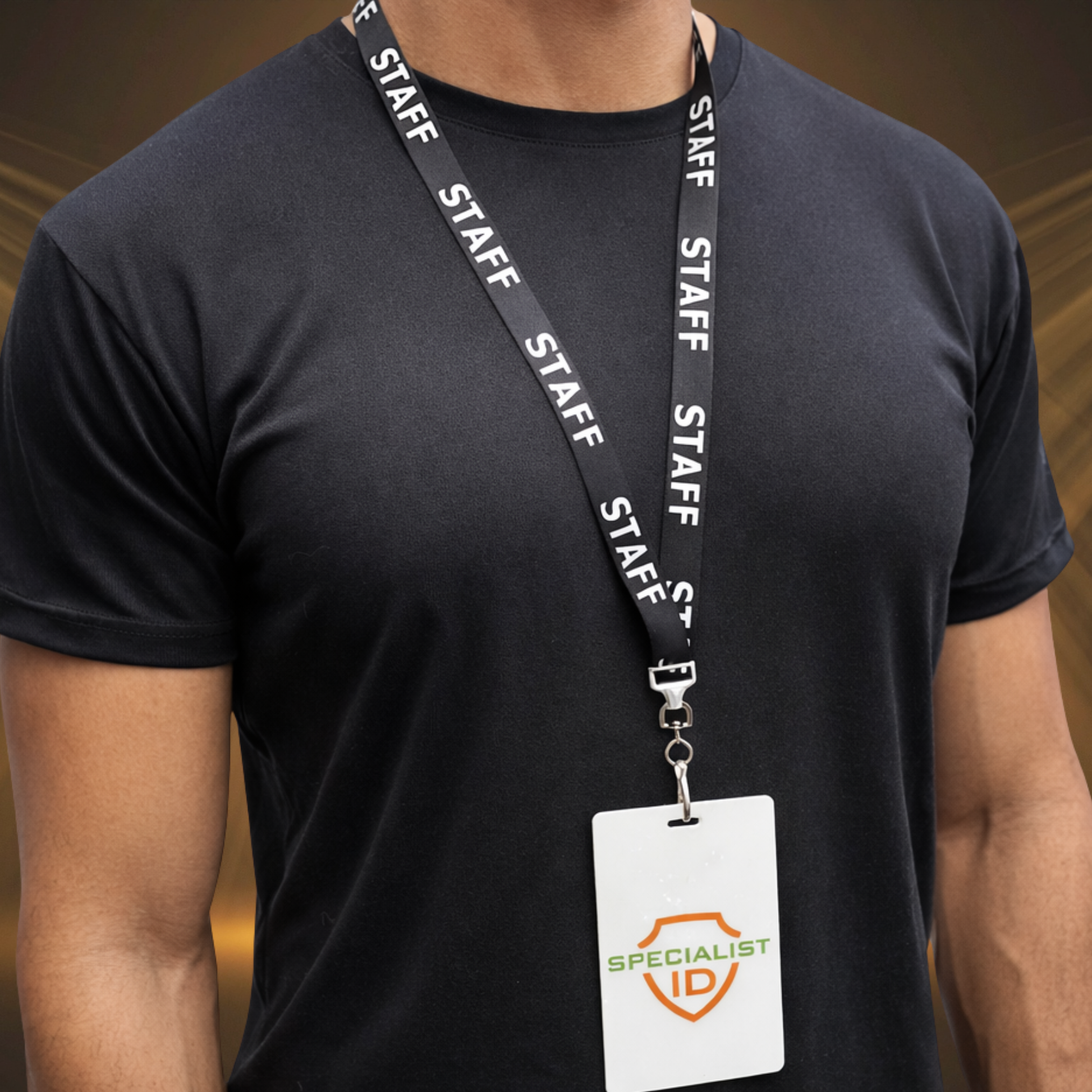 A person wearing a black t-shirt and a STAFF Lanyard with Standard Swivel Hook 2138-5210, displaying a badge with the "SPECIALIST ID" logo.