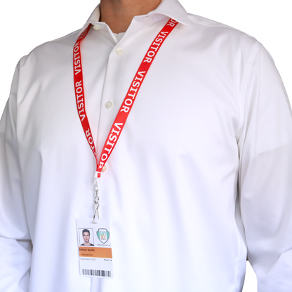 A person in a white dress shirt is wearing the Red Printed Visitor Lanyard with Swivel Hook (P/N 2138-5220) which provides added safety with its breakaway feature and swiveling hook for convenience.