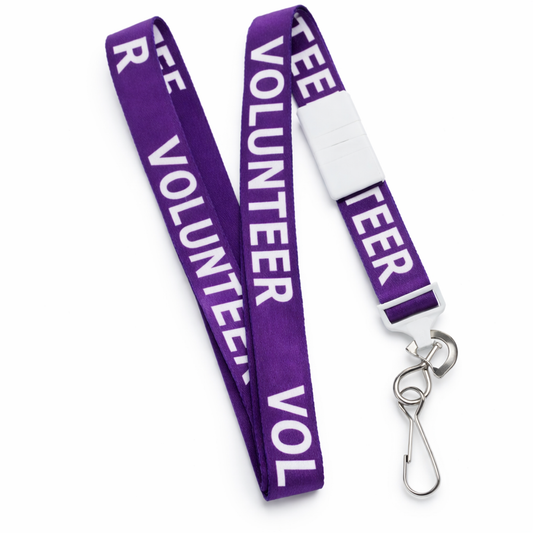 A Purple "Volunteer" Breakaway Lanyard W/ Swivel Hook 2138-5230 with "VOLUNTEER" in white text printed repeatedly, featuring a metal swivel hook and a convenient breakaway feature.