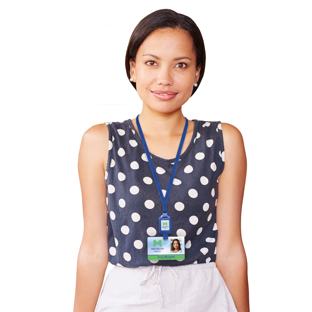 A person with short hair, wearing a sleeveless black and white polka dot top, stands indoors. They have an ID badge on a blue Customizable SlimReel Breakaway Lanyard ID Holder Badge Reel Combo (2138-800X) around their neck.