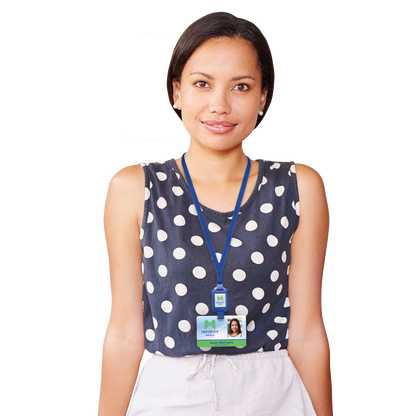 A person with short hair, wearing a sleeveless black and white polka dot top, stands indoors. They have an ID badge on a blue Customizable SlimReel Breakaway Lanyard ID Holder Badge Reel Combo (2138-800X) around their neck.