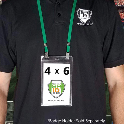 Person wearing a black shirt with a Specialist ID logo, displaying an ID badge holder with a 4x6 insert. The Double Clip Lanyard with 2 Bulldog Clips - Flat, Soft Material Neck Straps for Large Badge Holder Credentials (2140-530X) is equipped with a dual bulldog clip for secure attachment. Text below reads, "Badge Holder Sold Separately.