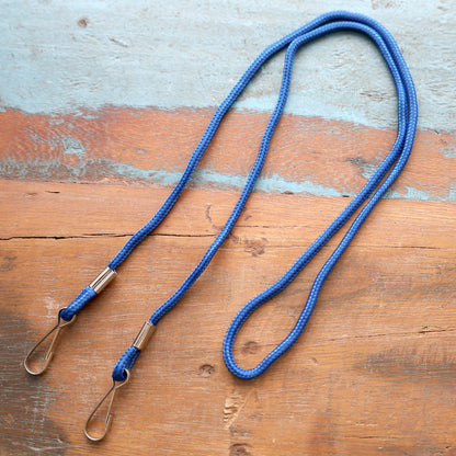Blue lanyard with double ended metal clips on a wooden surface. Sold by Specialist ID.