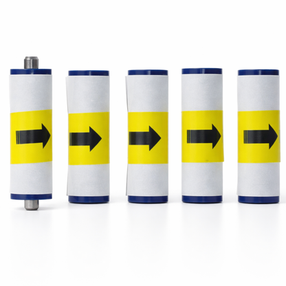 Five cylindrical objects (3633-0054 cleaning rollers for Magicard) with yellow stripes and black arrows on a white background