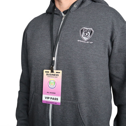 Person wearing a gray hoodie with a logo and a VIP pass lanyard on a white background. Sold by Specialist ID.