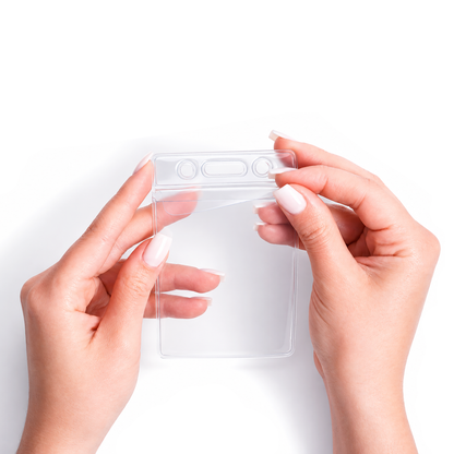 Two hands holding a Vinyl Vertical Badge Holder with Flap (506-24FS) against a white background.