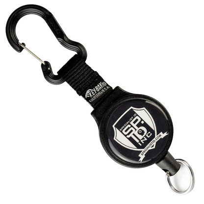 Customizable Key-Bak 6C Carabiner Badge Reel - Retractable Keychain Reel with 36" Cord and Easy Logo Upload with carabiner clip and round emblem displaying the text "SF INC" and "SPECIALIZED" logo. Personalized badge reels made from black fabric and plastic components are perfect to promote brand awareness.