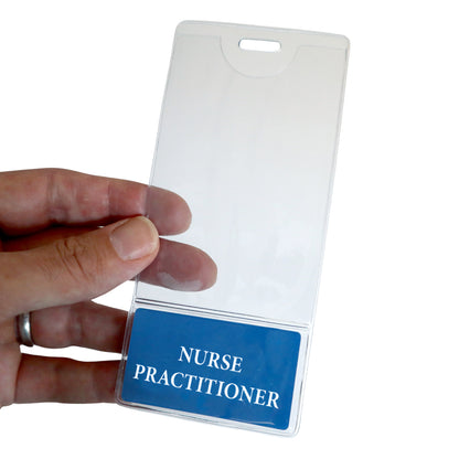 A hand holds the NURSE PRACTITIONER BadgeBottom Badge Holder, a vertical ID sleeve made from durable composite material, featuring a blue card at the bottom proudly labeled "Nurse Practitioner.