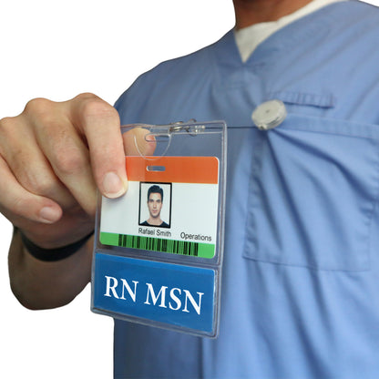 A person in blue scrubs holds the RN MSN BadgeBottom Badge Holder, featuring their photo and "RN MSN" on a horizontal ID badge sleeve with a bottom role tag, highlighting their role in the healthcare team.