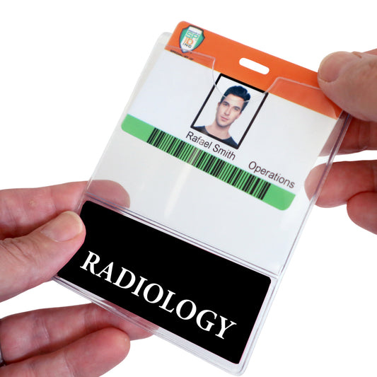 A person holds a RADIOLOGY BadgeBottom Badge Holder, exhibiting an ID badge with Rafael Smith's photo and "Operations" title. Sold by Specialist ID.