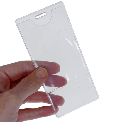 A hand holding a Premium Vinyl Vertical BadgeBottom with Slot - Holder Only, perfect for professionals to display their title insert. Sold by Specialist ID.