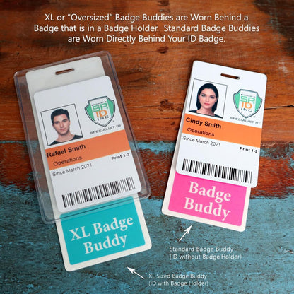 Two hospital ID badges on a wooden surface: one reads "Rafael Smith Operations," enhanced with an Extra Large Leader Badge Buddy – XL Badge Backer for Leaders, and the other is "Cindy Smith Operations," accompanied by a standard badge buddy.