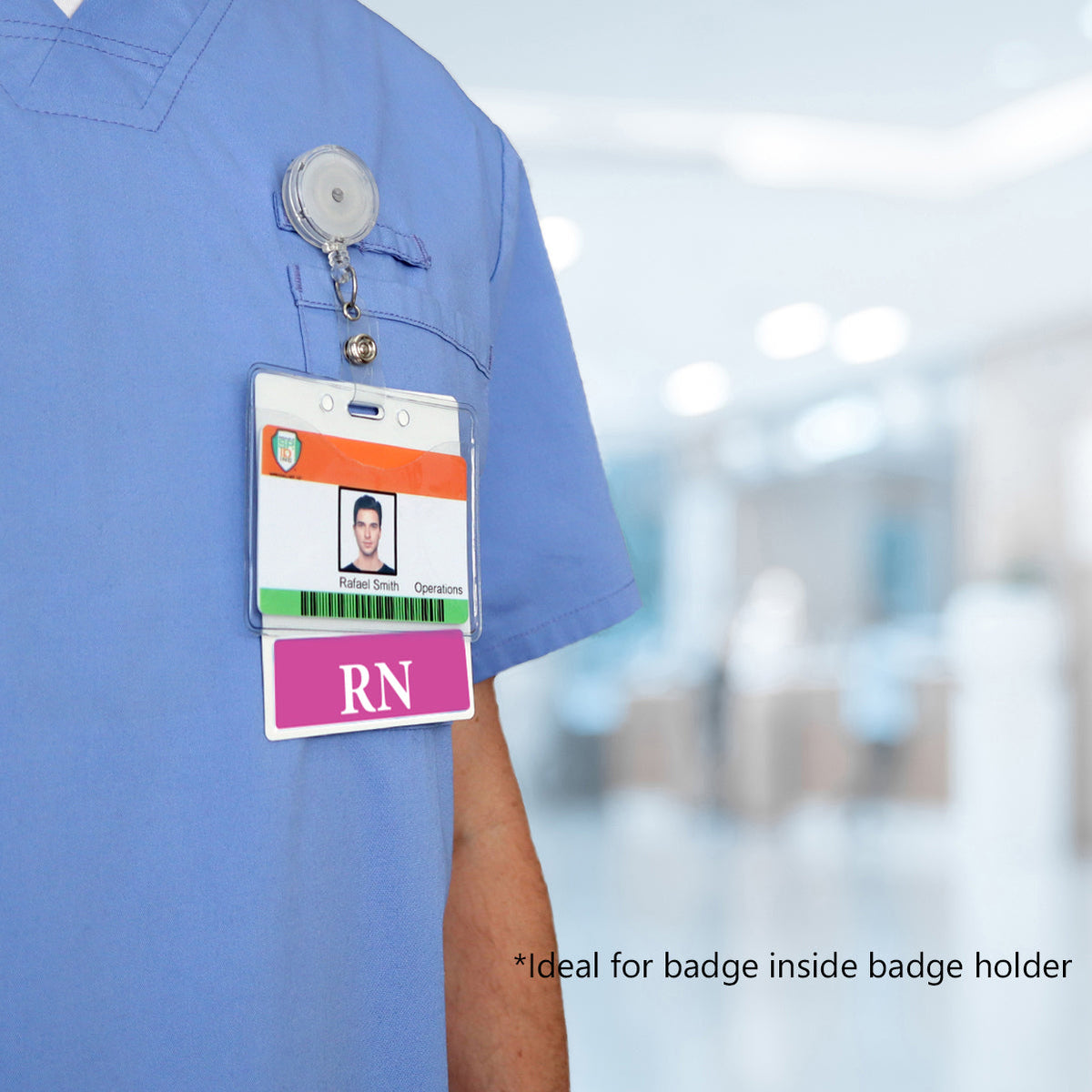 XL horizontal badge buddy worn on scrubs behind an ID in a badge holder