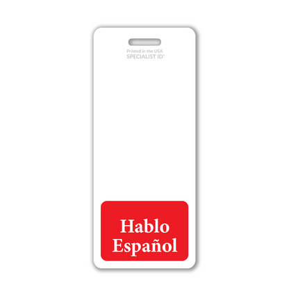 The Oversized "Hablo Español" Badge Buddy Vertical is a white badge backer featuring a prominent red label at the bottom with "Hablo Español" in bold white text. The badge includes a horizontal slot at the top for easy attachment and small printed details, making it an ideal bilingual ID accessory for retail, hospital, or warehouse employees who speak Spanish.