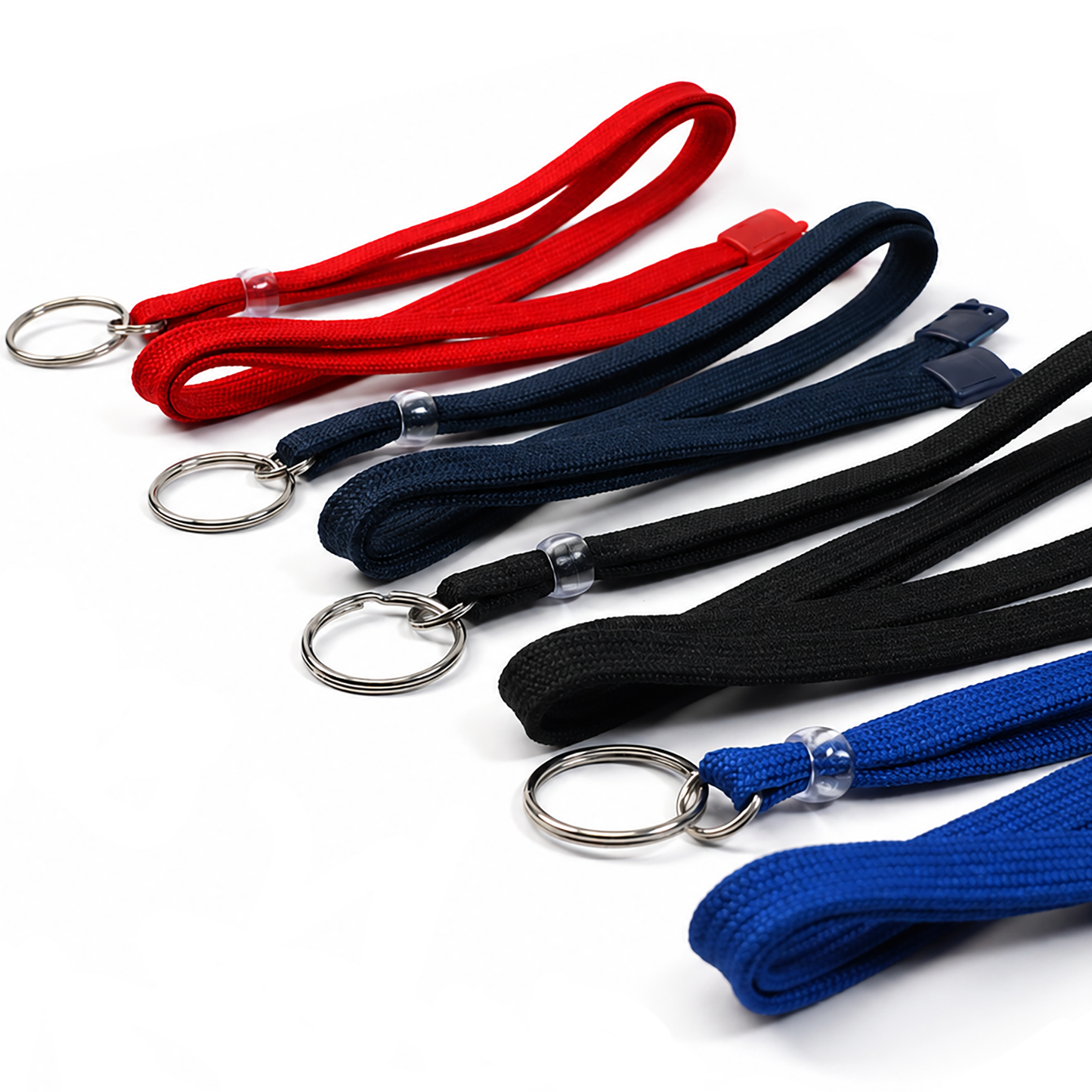 Five woven lanyards in red, navy, black, and blue, each attached to a silver metal key ring, arranged diagonally on a white background.