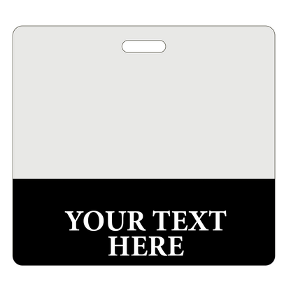 A blank, white name badge with a black strip at the bottom displays the placeholder text "YOUR TEXT HERE" in white capital letters, perfect for Custom Printed Clear Badge Buddies Horizontal (Standard Size) - Customize with Title and Color.