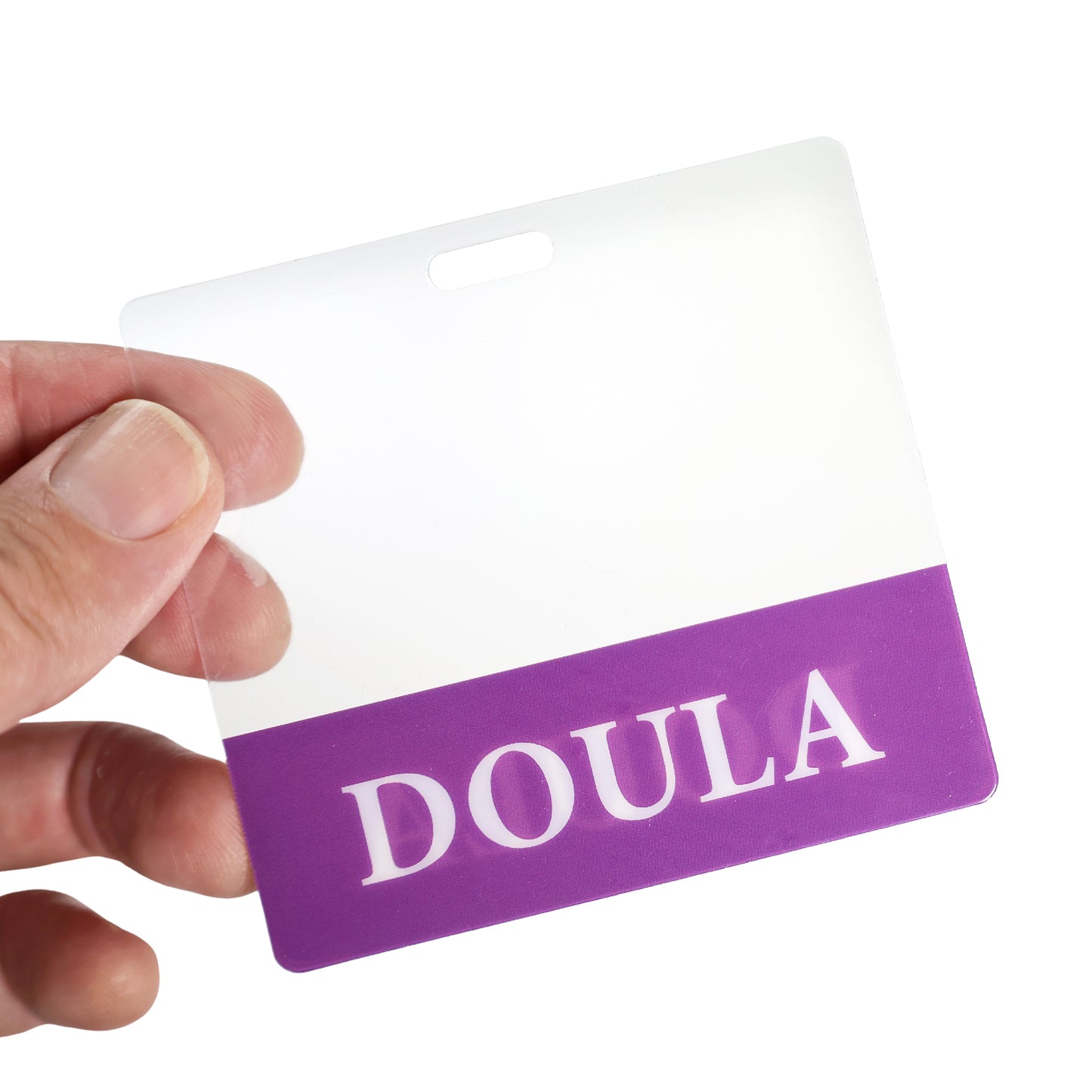 A hand holds the Clear DOULA Badge Buddy, a horizontal nurse ID badge backer with double-sided print and a purple "DOULA" section—perfect for birthing doulas or as a doula badge buddy.