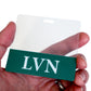 Hand holding a blank name badge with a green stripe at the bottom featuring the letters "LVN", acting as a perfect Clear LVN Badge Buddy - Horizontal ID Badge Backer for Licensed Vocational Nurses - Double Sided Print.