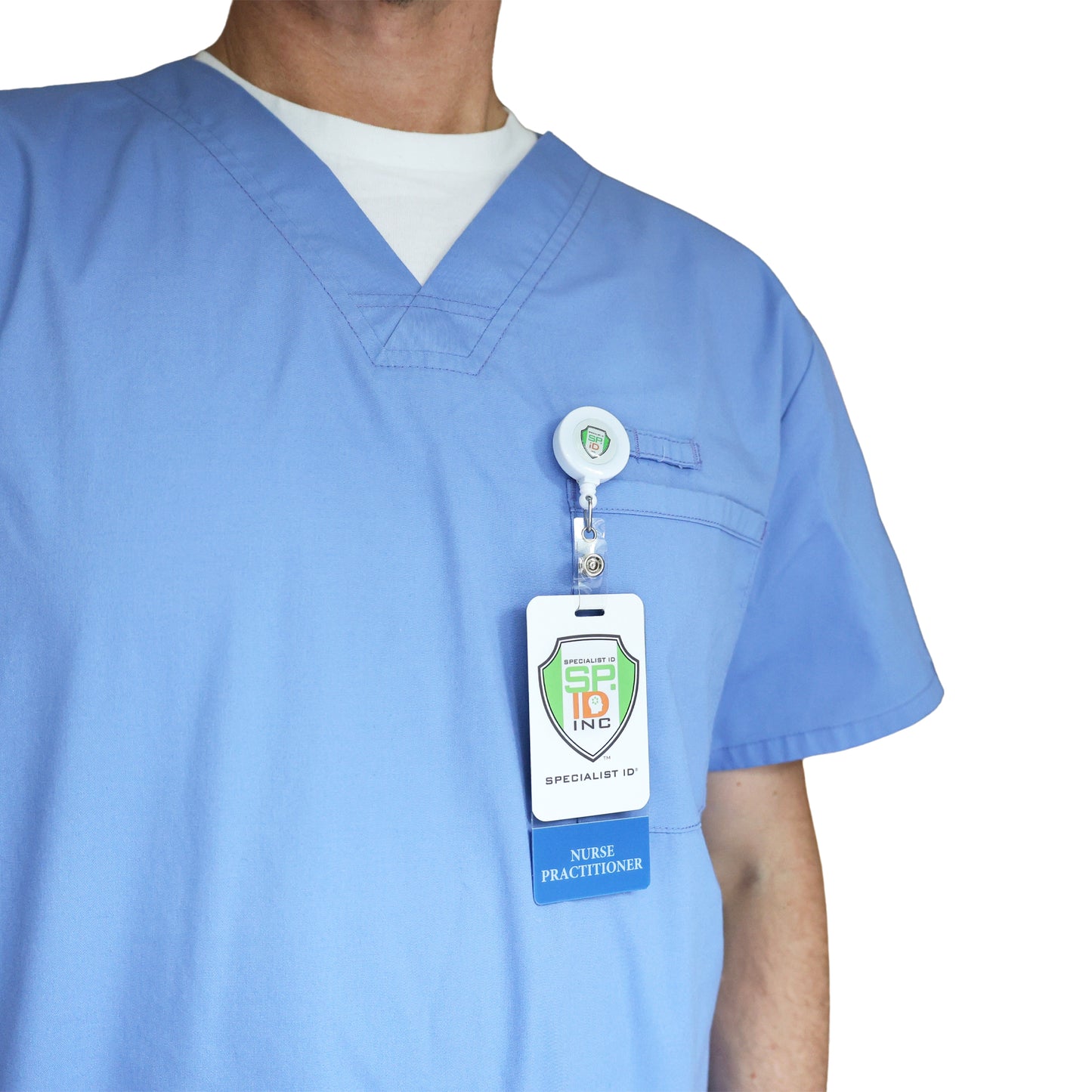A person wearing blue medical scrubs and a white undershirt, with a Clear NURSE PRACTITIONER Badge Buddy Vertical with Blue Border for Nurses and an ID badge clipped to their chest.