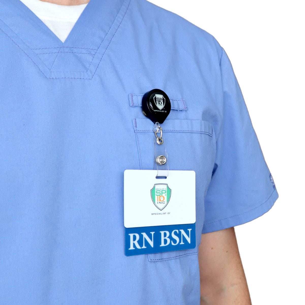 Person wearing light blue scrubs with a Clear RN BSN Badge Buddy - Horizontal Nurse ID Badge Backer - Double Sided Print and a retractable badge holder clipped to the chest pocket.