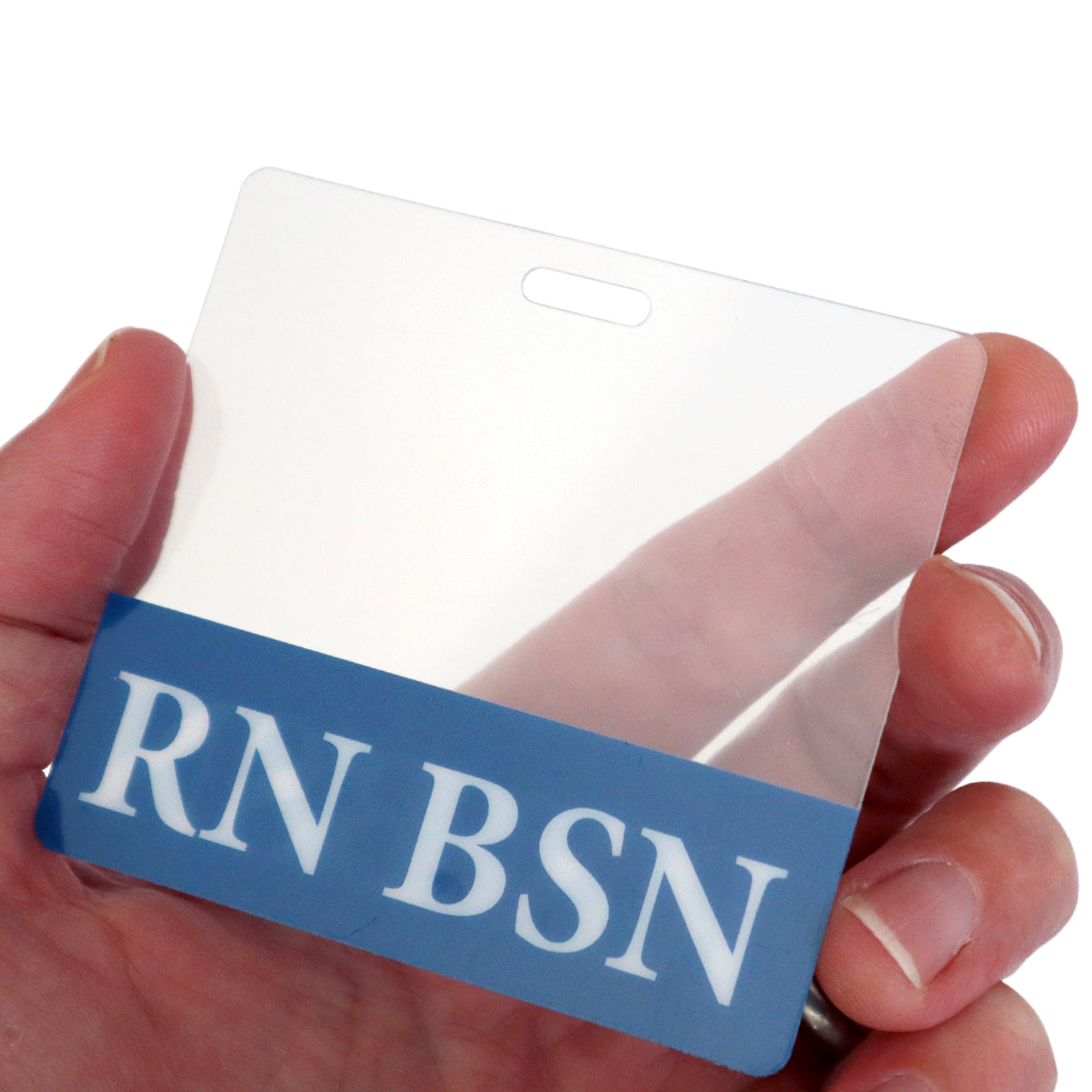 A hand holding a Clear RN BSN Badge Buddy - Horizontal Nurse ID Badge Backer - Double Sided Print with a blue strip at the bottom displaying the text "RN BSN" in white letters.