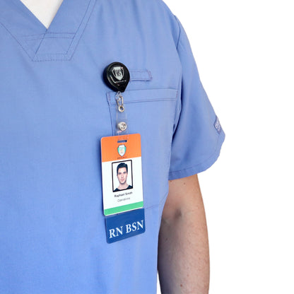 A person in blue scrubs with a Clear RN BSN Badge Buddy Vertical with Blue Border for Nurses clipped to a retractable badge holder on their chest pocket. Sold by Specialist ID.