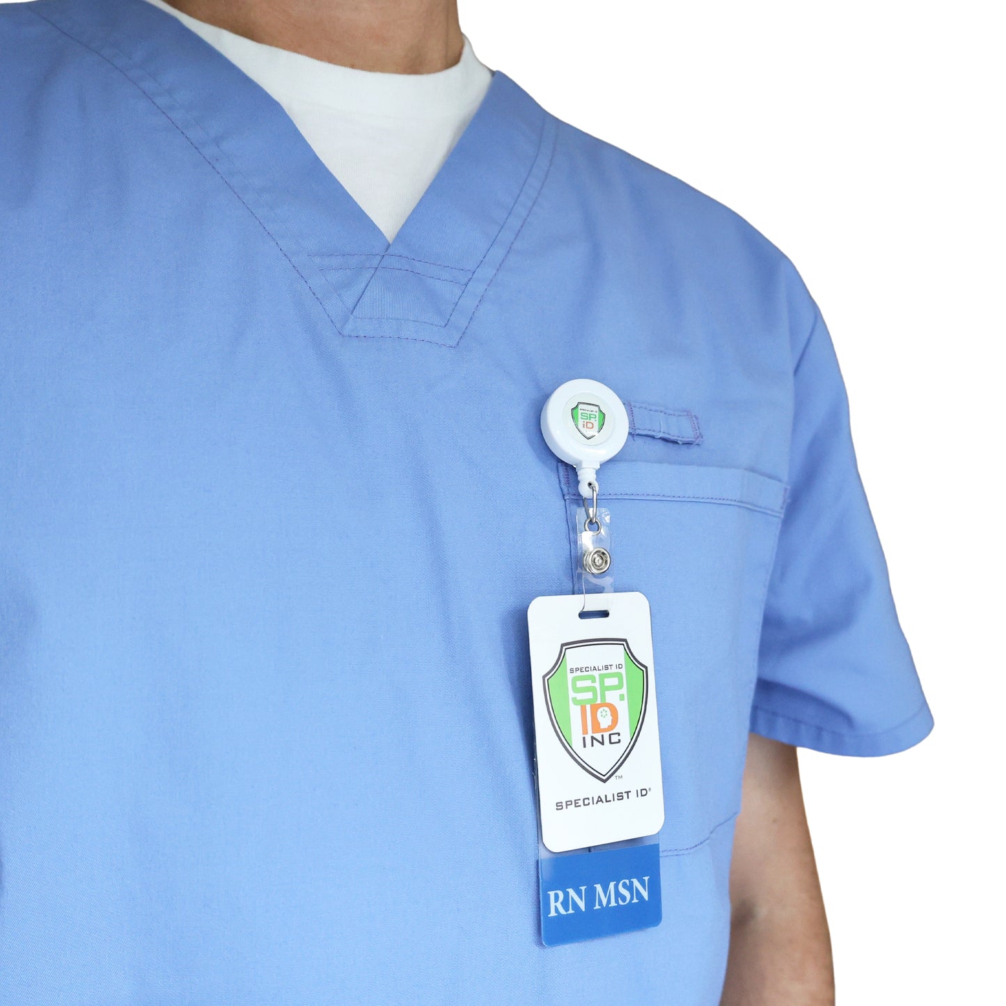 A nurse in light blue scrubs wears the Clear RN MSN Badge Buddy Vertical with Blue Border for Nurses clipped to a retractable badge holder on their chest pocket. Sold by Specialist ID.