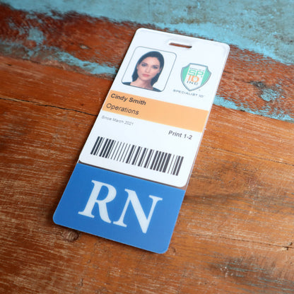 Clear vertical badge buddy behind a hospital photo ID, with the blue RN title bar showing below the ID