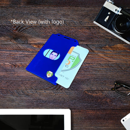 Blue customizable Custom 2-Sided Rigid Vertical Multi-Card Holder (1840-308X) - Add Your Logo with a visible photo ID card partially slid out, placed on a wooden table next to an analog camera and a pair of glasses. Text labeled “Back View (with logo)” is on the image, highlighting its professional look.