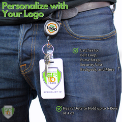 A person wearing jeans has a keychain with a logo attached to a belt loop via a Custom Compact Key-Bak Retractable Carabiner ID Badge Reel with Key Ring and Your Logo. The keychain also carries an ID card, secured by the retractable Kevlar cord of the Key-Bak. Text on the image lists uses and weight capacity of the clip.
