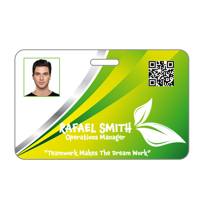 Custom Printed Photo ID Badge featuring a headshot of a man, labeled "Rafael Smith, Operations Manager," with a QR code and the quote "Teamwork Makes The Dream Work." Professionally designed using an Online ID Card Printing Service, the background has green, yellow, and white design elements.