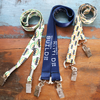 Three Custom Double Ended Lanyards with metal clips are shown on wood; two have a 