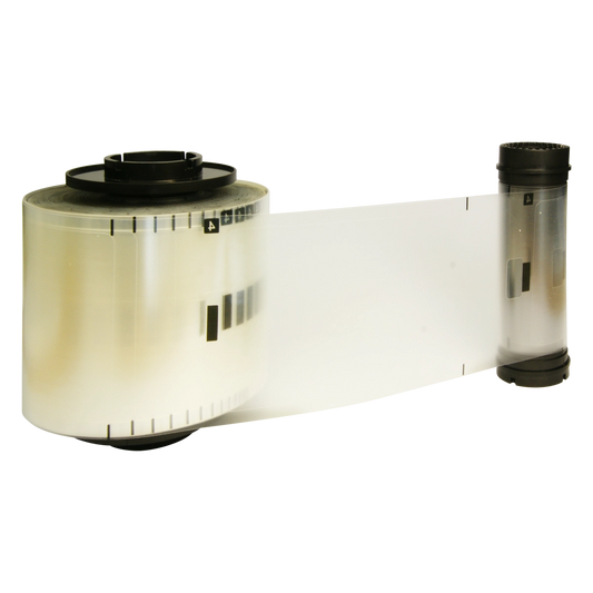 A roll of transparent film, with a segment extending outwards, featuring black markings and a cylindrical core, includes an IDP 653631 SMART-81L Clear IC Chip 1mil Patch Laminate Film - 500 Patches/Roll for an added protective layer.