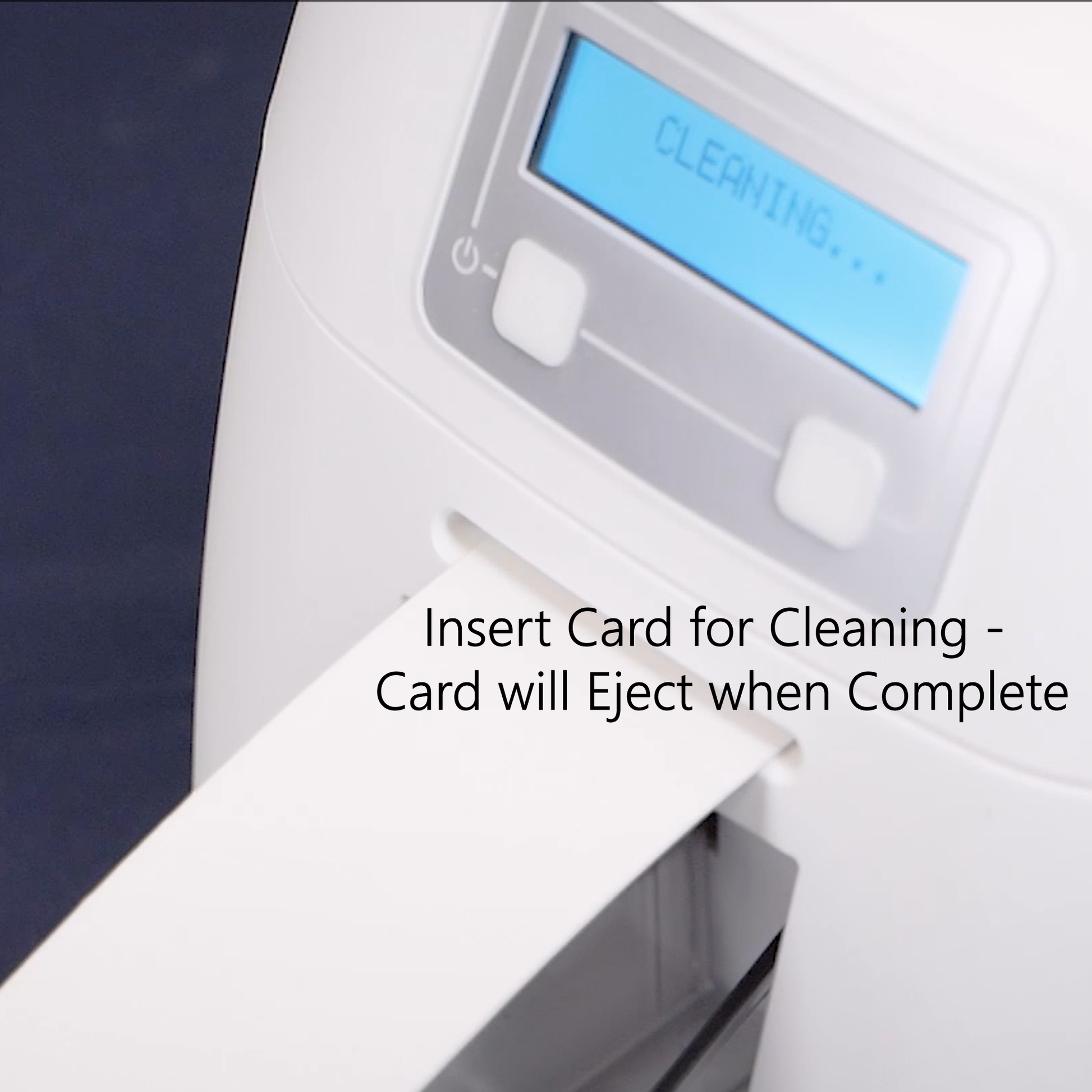 Cleaning card in action with digital display of the ID badge printer and text indicating card insertion for cleaning.