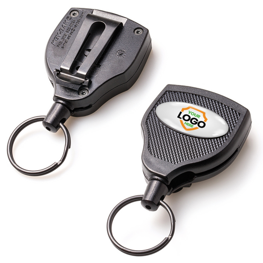 Two black retractable keychains, one showcasing its back with a clip and the other spotlighting a logo space, both featuring a keyring at the end. These Customizable Key-Bak Super 48 Heavy Duty Key Reel (S48K) - Customize with Your Own Logo and Design are known for their rugged durability and can be customized into badge reels.