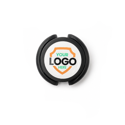 SPID-3820-BLACK-DOME Black / Dome label - A Custom Stethoscope ID Tag featuring a black circular design with "YOUR LOGO HERE" is displayed before an orange shield on a white background, ideal for medical staff identification.