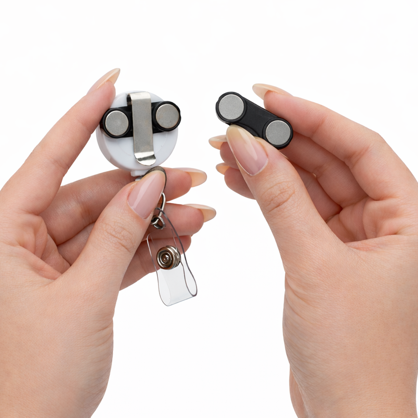 A person holds the Magnet Badge Reel - Retractable Magnetic Badge Holder for Shirt Pocket (P/N SPID-3370) in one hand and a black magnetic badge holder in the other, both against a white background.