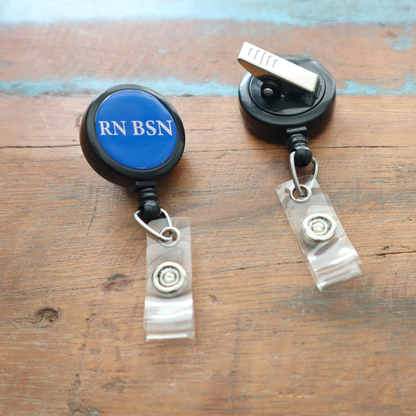 The RN BSN Badge Buddy Reel with Swivel Spring Clip combines a retractable reel and RN BSN Badge Buddy in one, allowing nurses to display credentials clearly and securely. Sold by Specialist ID.