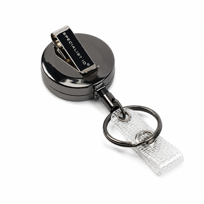 SPID-3450 metal round retractable badge reel with a silver metal clip engraved with 'SPECIALIST 10', attached to a clear textured strap on a white background.