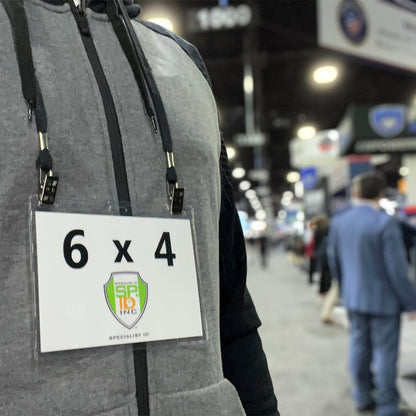 Black double clip lanyard holding a 6 x 4 event badge