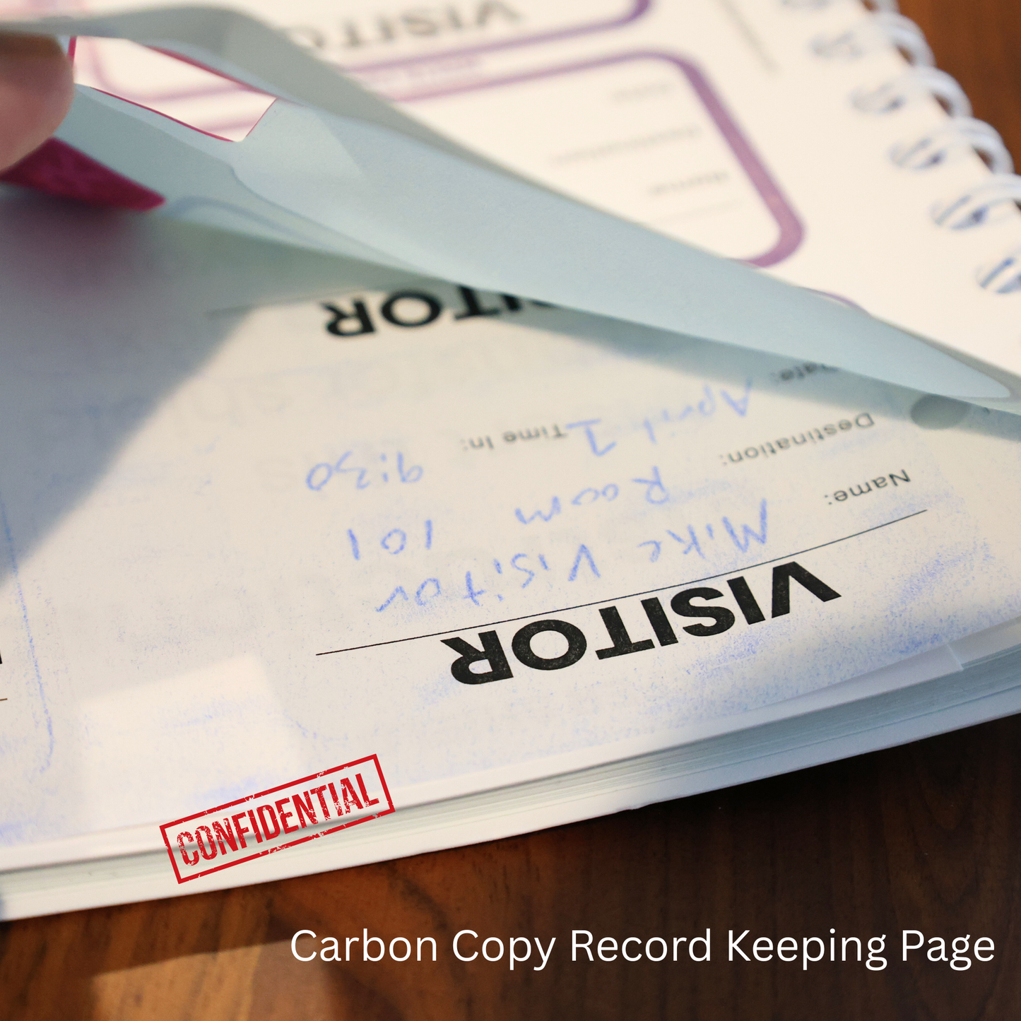 A person holds a white piece of paper, but instead of a product description, the text is just CSS code—not information about the Expiring Visitor Badge Stickers Log Book – One-Day Security Badges with Sign-In Records.
