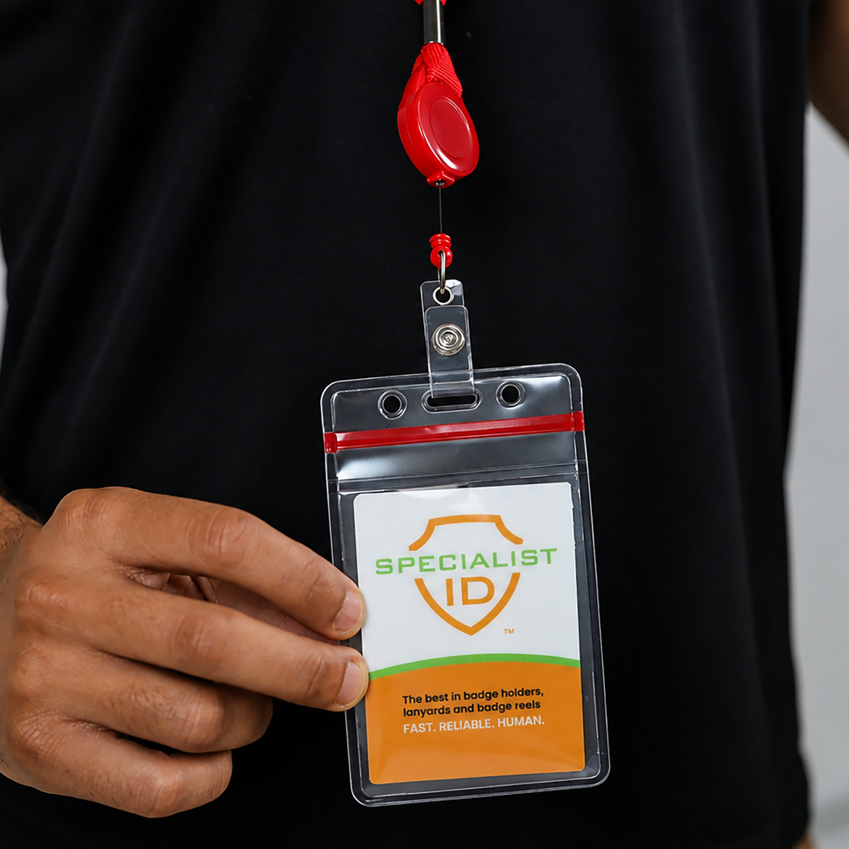 A Specialist ID card displayed in a Cruisin Through Life™ Retractable Badge Reel Lanyard with Resealable Zip Holder (SPID-9101) attached to a red retractable badge reel.