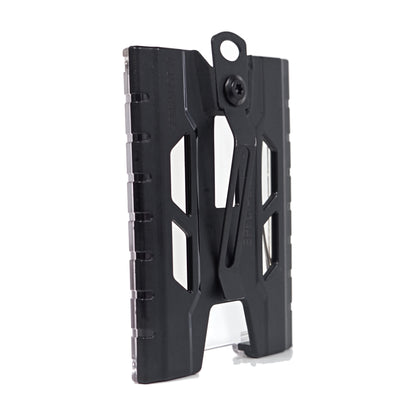 Black TEST-123 rigid vertical ID badge holder turned 45 degrees to the back, showing the metal spring belt clip riveted to the rear panel.