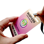 Close-up of hands attaching a lanyard to a Custom Printed Event Badge with Three Slot Holes—designed for the "Business Conference 2030" with "All Access" on a gradient pink background, showcasing clear, modern CSS-inspired style.