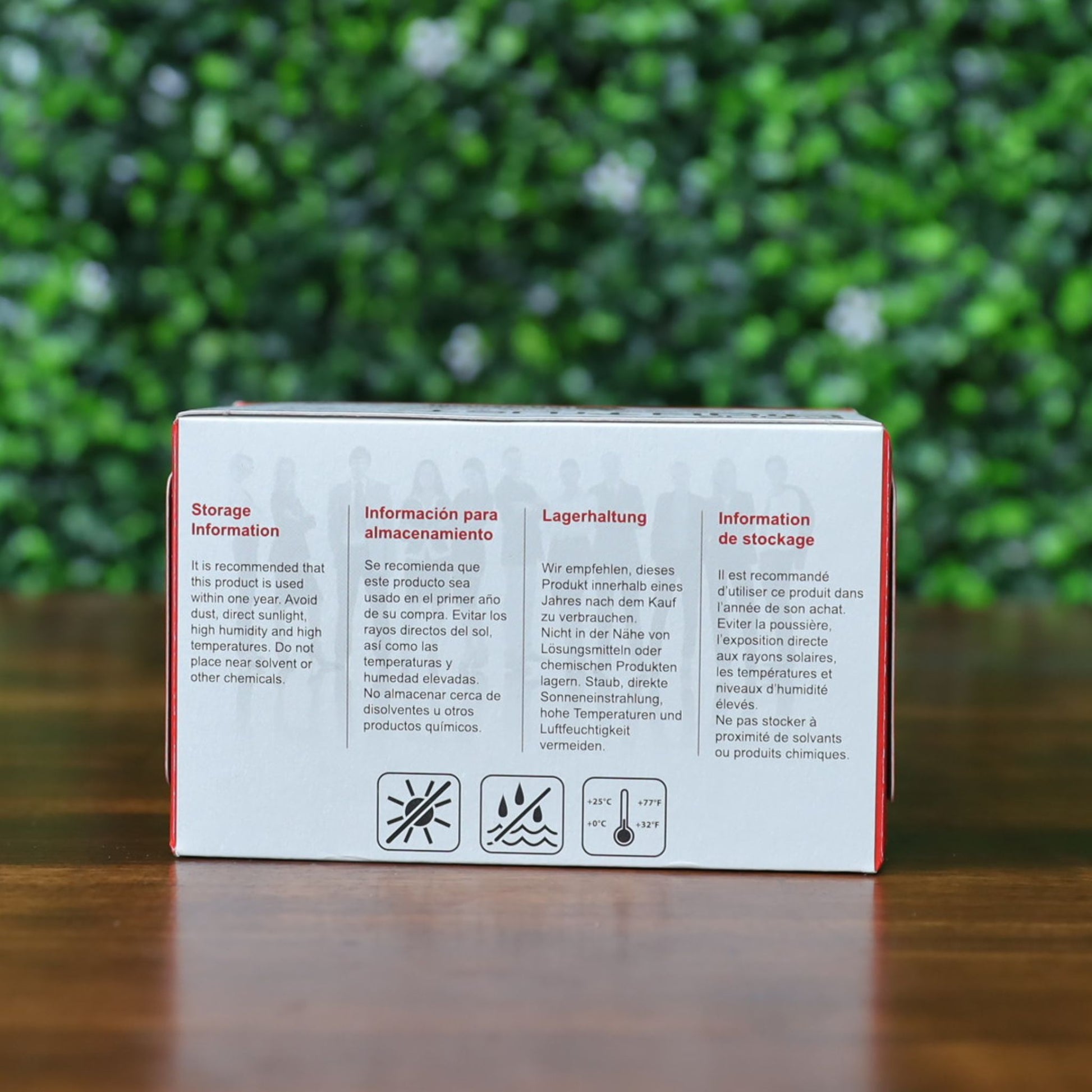 Back of Evolis R3314 YMCKOK Ribbon box showing storage and handling instructions in multiple languages, including icons for sunlight, humidity, and temperature limitations. Photographed and sold by Specialist ID, an authorized Evolis dealer.